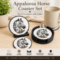 Appaloosa Horse Coaster Set featuring four round coasters with black-rimmed edges and a white center printed with an Appaloosa horse illustration, shown with two black coasters on a wooden table alongside a ceramic mug, a plant, and a beige cloth. Text at the top reads 'Appaloosa Horse Coaster Set' and a feature banner at the bottom lists included details.