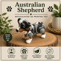 An Australian Shepherd 3D-printed articulated toy dog standing on a round wood slice, with decorative plants in the background. The image includes text overlays reading 'Australian Shepherd', 'Articulated 3D Printed Toy', 'Made with PLA', and feature icons for 3D printing, great gift for dog lovers, eco-friendly materials, and not suitable for children under 3.