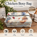 A fabric chicken box bag with a rustic rooster print, shown on a wooden table with decorative props. The image includes text reading 'Chicken Boxy Bag' with dimensions '8 x 5 x 3 inches,' a circular inset showing the full lining, and feature icons for hand sewn, full lining, dimensions, and gift idea.