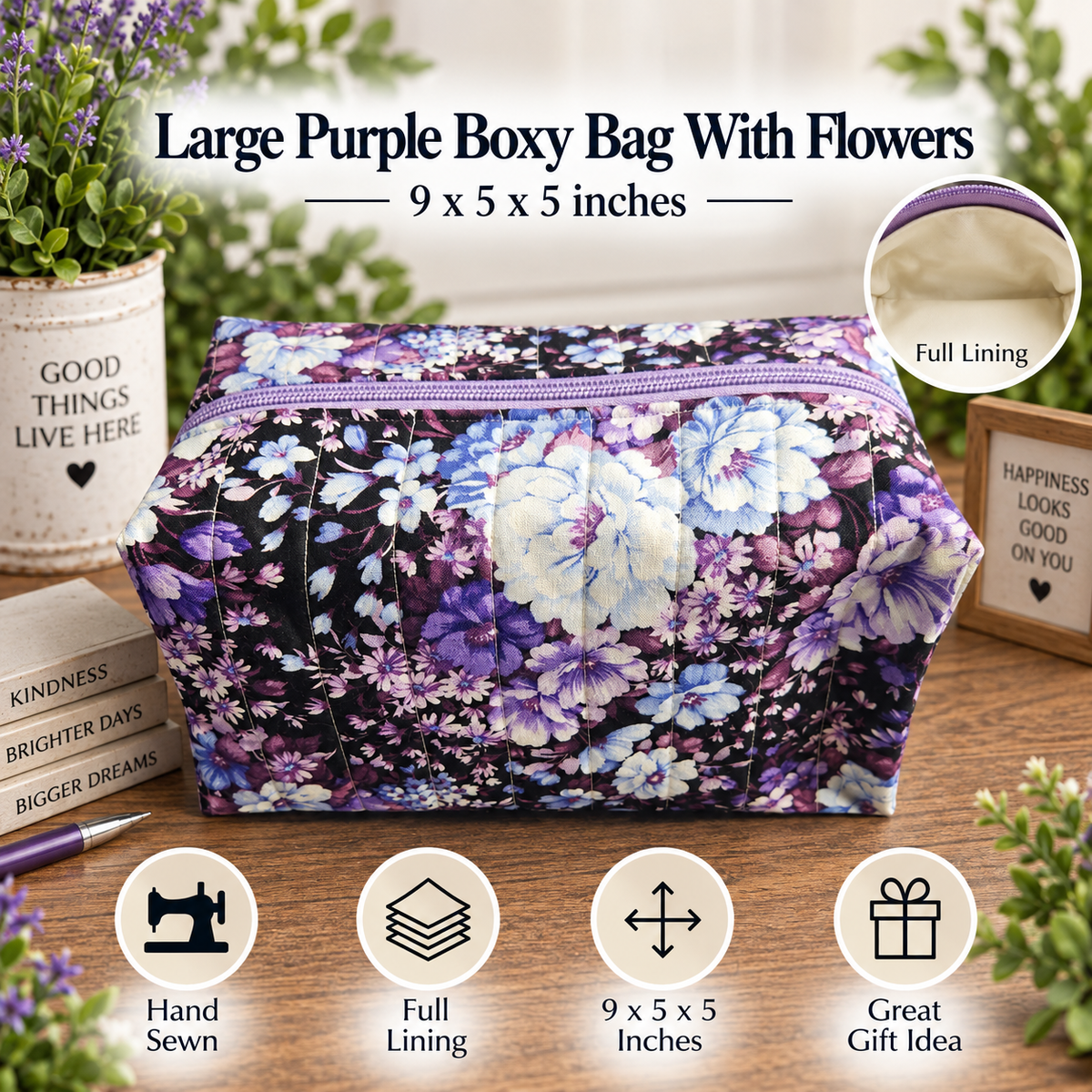 A large purple floral boxy bag with a purple zipper, displayed on a wooden surface with decorative props. The bag features a purple, blue, and white floral pattern on a dark background.