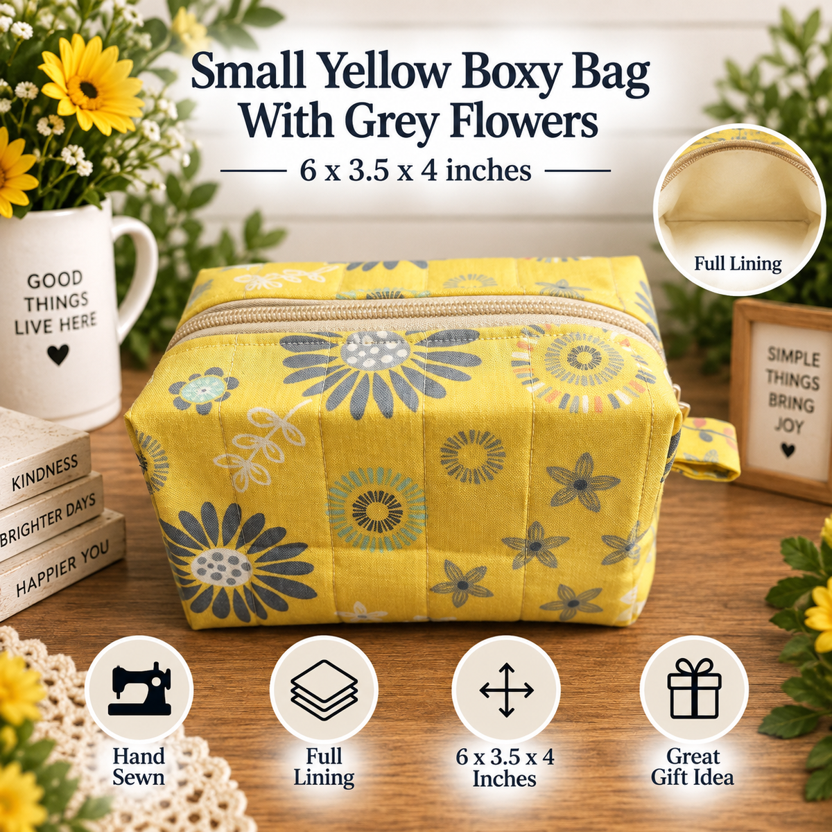 A yellow quilted boxy bag with a grey and blue floral pattern, shown on a wooden table with decorative flowers, books, and text overlays describing its size and features.