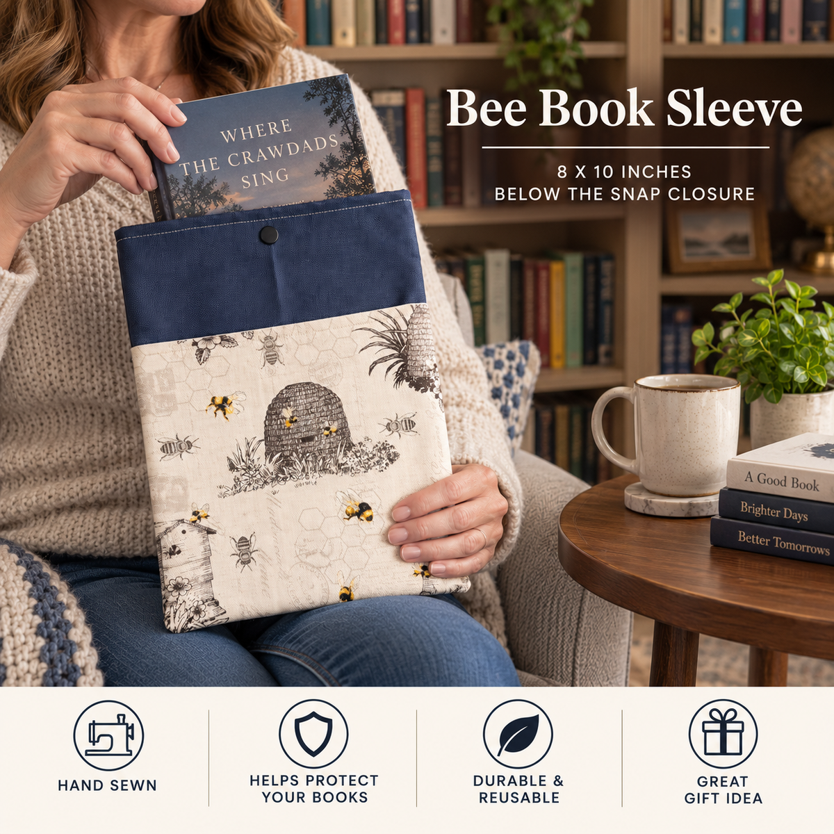 A person seated in a cozy room holds a reusable book sleeve with a navy top band and a cream printed bee-and-beehive pattern. The sleeve is shown holding a book under a snap closure, with text reading 'Bee Book Sleeve' and feature icons along the bottom.