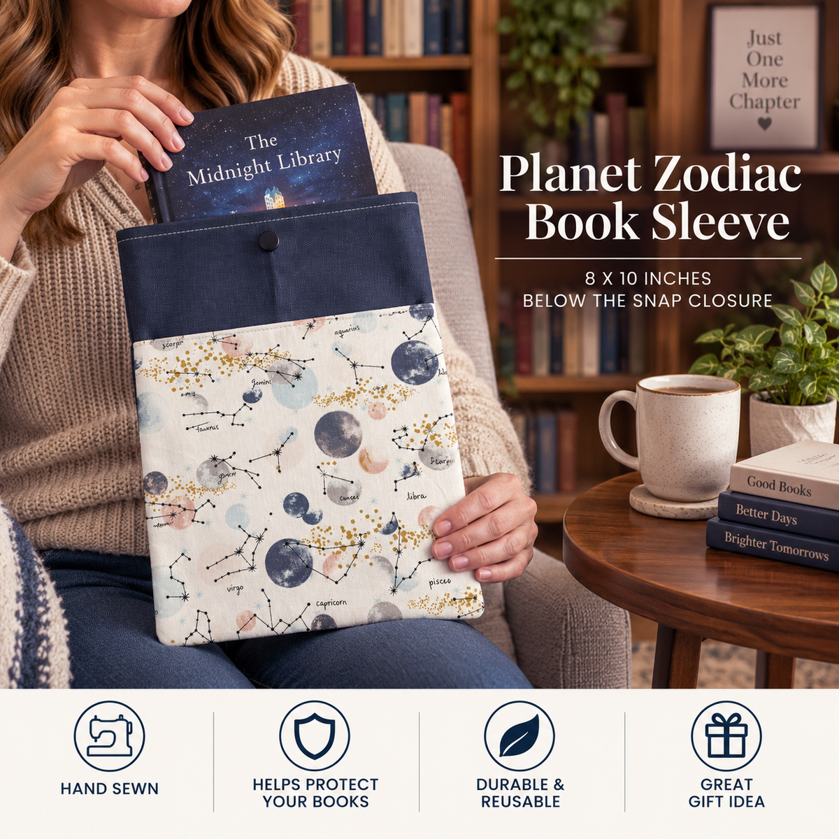 A woman in a cozy living room setting holds a Planet Zodiac book sleeve. The sleeve features a navy blue top flap with a snap button and a cream-colored lower section decorated with a watercolor-style constellation pattern.