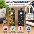 Two fabric lip balm holders with a navy blue background and yellow star pattern, shown on a tabletop with keys, a lip balm tube, and decorative text explaining the product.