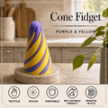 A purple and yellow spiral cone fidget toy displayed on a marble coaster on a kitchen countertop, with text reading 'Cone Fidget' and 'Purple & Yellow' plus feature icons along the bottom.
