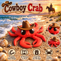 A red plastic crab toy wearing a brown cowboy hat, shown on a sandy beach with ocean waves and a sunset in the background. The image includes a large 'Cowboy Crab' title, two circular close-up insets of the toy, and four feature icons at the bottom describing poseable flexi design, 3D printed in PLA, great gift for all ages, and unique and fun.