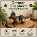 Black and Tan German Shepherd dog standing on a round of wood on a table with green plants