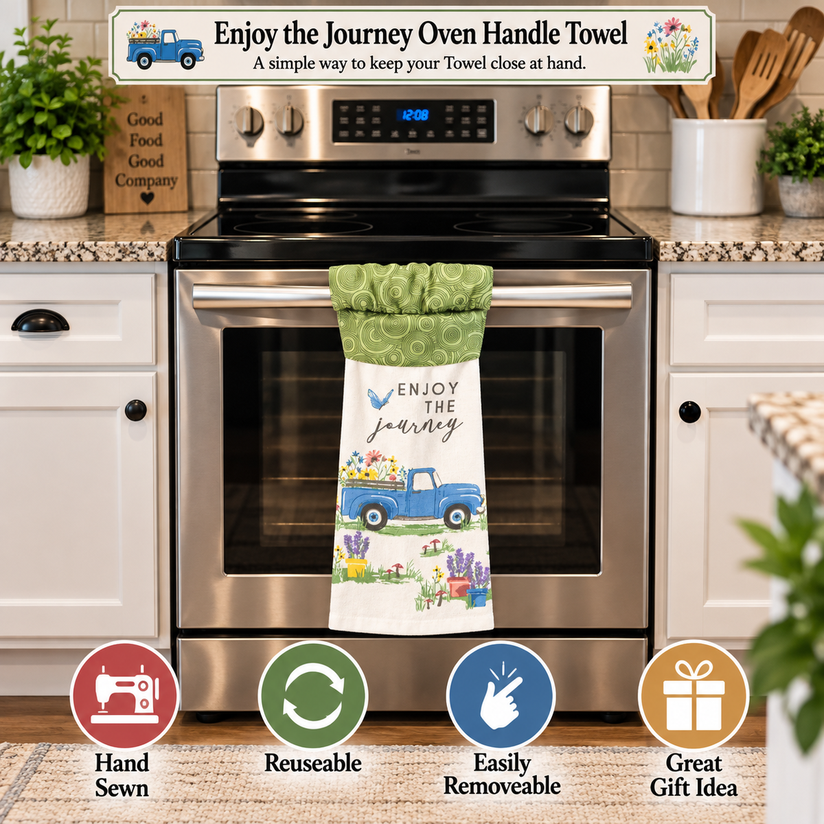 A kitchen towel hanging from an oven handle in a real kitchen setting. The towel has a white lower section with a blue pickup truck and the words “ENJOY THE Journey,” plus a green patterned upper section.