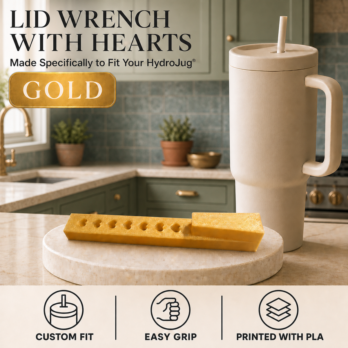 A gold metal lid wrench with a heart-shaped center is shown on a countertop next to a beige insulated tumbler. The background is a kitchen with green cabinets and blue-gray tile.