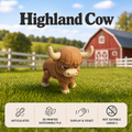 A small articulated Highland Cow toy stands on a green grassy field with a blurred red barn and white fence in the background. Large text at the top reads 'Highland Cow,' and a beige info panel at the bottom lists features: articulated, 3D printed sustainable PLA, display & fidget, and not suitable under 3.