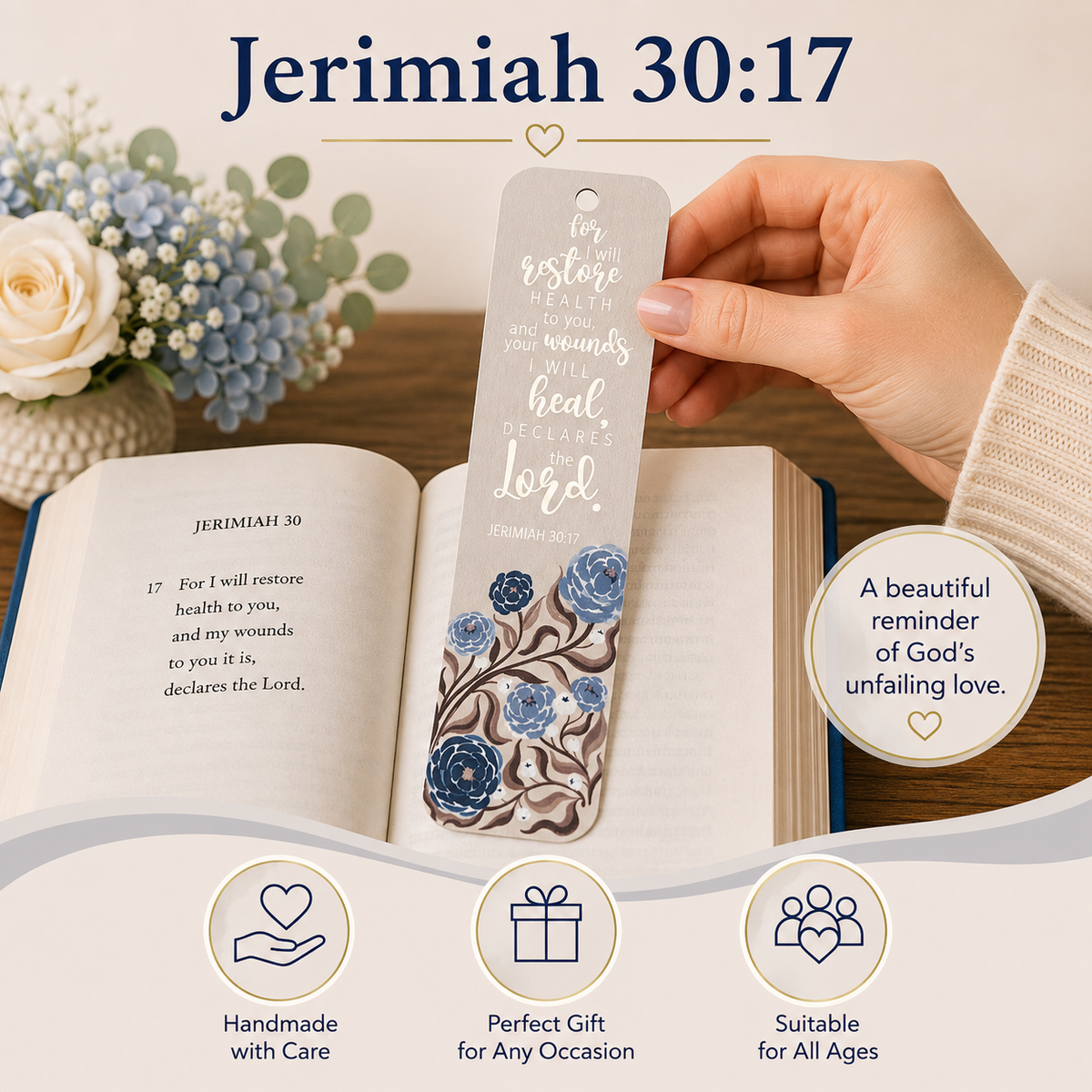A hand holds a silver bookmark printed with the Bible verse Jeremiah 30:17 over an open book. The bookmark has a silver-gray top with white script text and a blue floral illustration at the bottom.
