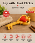 A 3D printed key-shaped fidget toy with a red heart in the center, shown on a wooden surface with decorative props. The image includes text reading 'Key with Heart Clicker', '3D Printed Fidget', 'RED HEART', and feature icons for eco-friendly PLA, 3D printed PLA, fidget fun, great gift idea, and not suitable for children under 3.