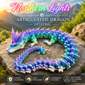 A colorful articulated dragon toy displayed on a large rock outdoors, with mountains and trees in the background. Large text at the top reads 'Northern Lights Articulated Dragon 24" Long,' and feature icons along the bottom mention durable PLA material, fully articulated shape, lightweight and flexible, and not suitable for children under 3.