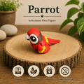 Red 3D printed Parrot Flexi with articulated body, yellow accents and expressive eyes, printed by Twin Cedars Maker Company.
