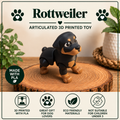 Rottweiler Flexi toy standing on a wood round  that is placed on a table with a few green plants