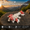 A small articulated toy wivern made of flexible white plastic with red and white spotted mushroom caps, posed on a large rock with a mountain sunset background. Text at the top reads 'SMALL MUSHROOM WYVERN 3.