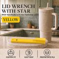 A yellow lid wrench with a star-shaped tip is displayed on a marble coaster in a kitchen setting, next to a beige HydroJug travel tumbler. The image includes text overlays describing the product as a 'LID WRENCH WITH STAR' and 'YELLOW', along with feature icons at the bottom.