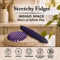 Two textured stretchy fidget toys in purple and navy blue displayed on a stone coaster, with promotional text reading 'Stretchy Fidget' and 'INDIGO SPACE' above, and feature icons below.