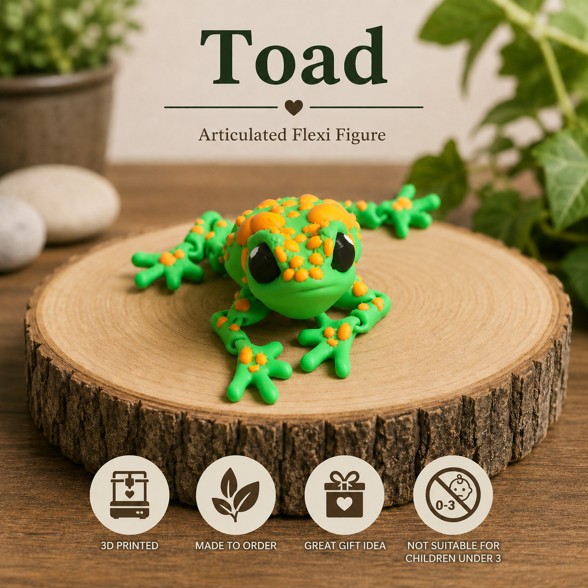 A green and orange toad articulated flexi figure displayed on a round wood slice coaster. The background features blurred green foliage and stones, with text reading 'Toad Articulated Flexi Figure' at the top and three feature icons at the bottom indicating '3D PRINTED', 'MADE TO ORDER', and 'GREAT GIFT IDEA'.